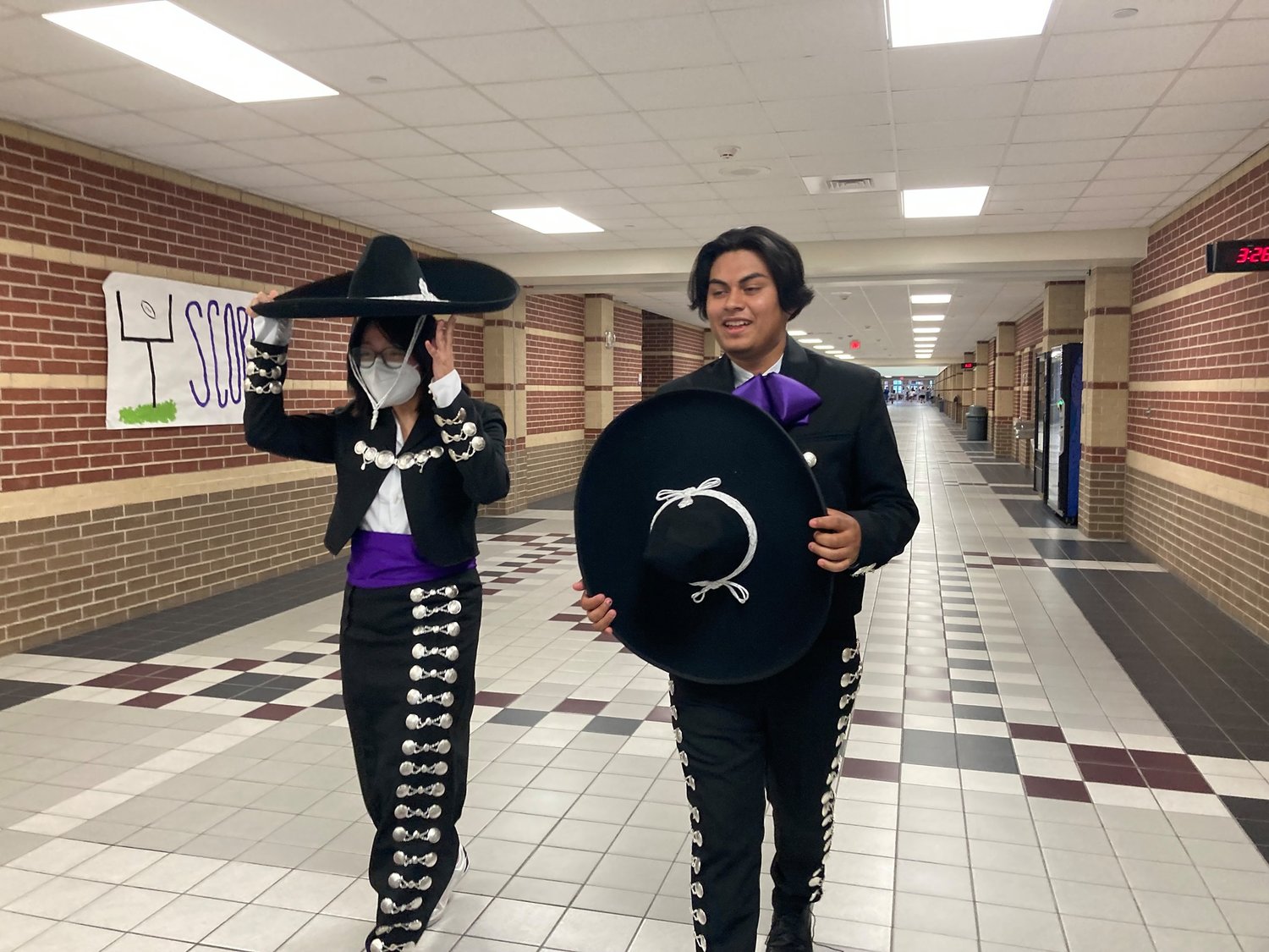 MRHS mariachi group members Evelyn Garcia and Pedro Barrera display the group's new mariachi uniforms. The group is preparing this year for possible UIL competition performances next school year.